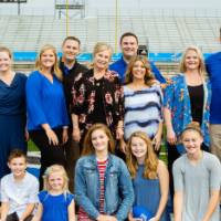 A group photo on the field at the Jamie Hosford Football Center dedication.
